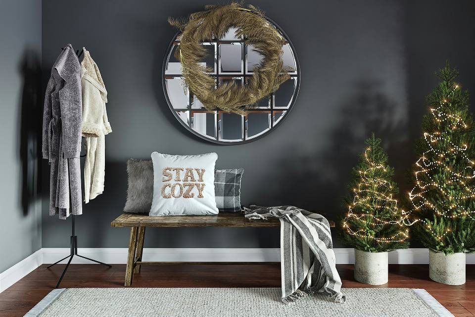 entry way with dark wood flooring and area rug and holiday decor.